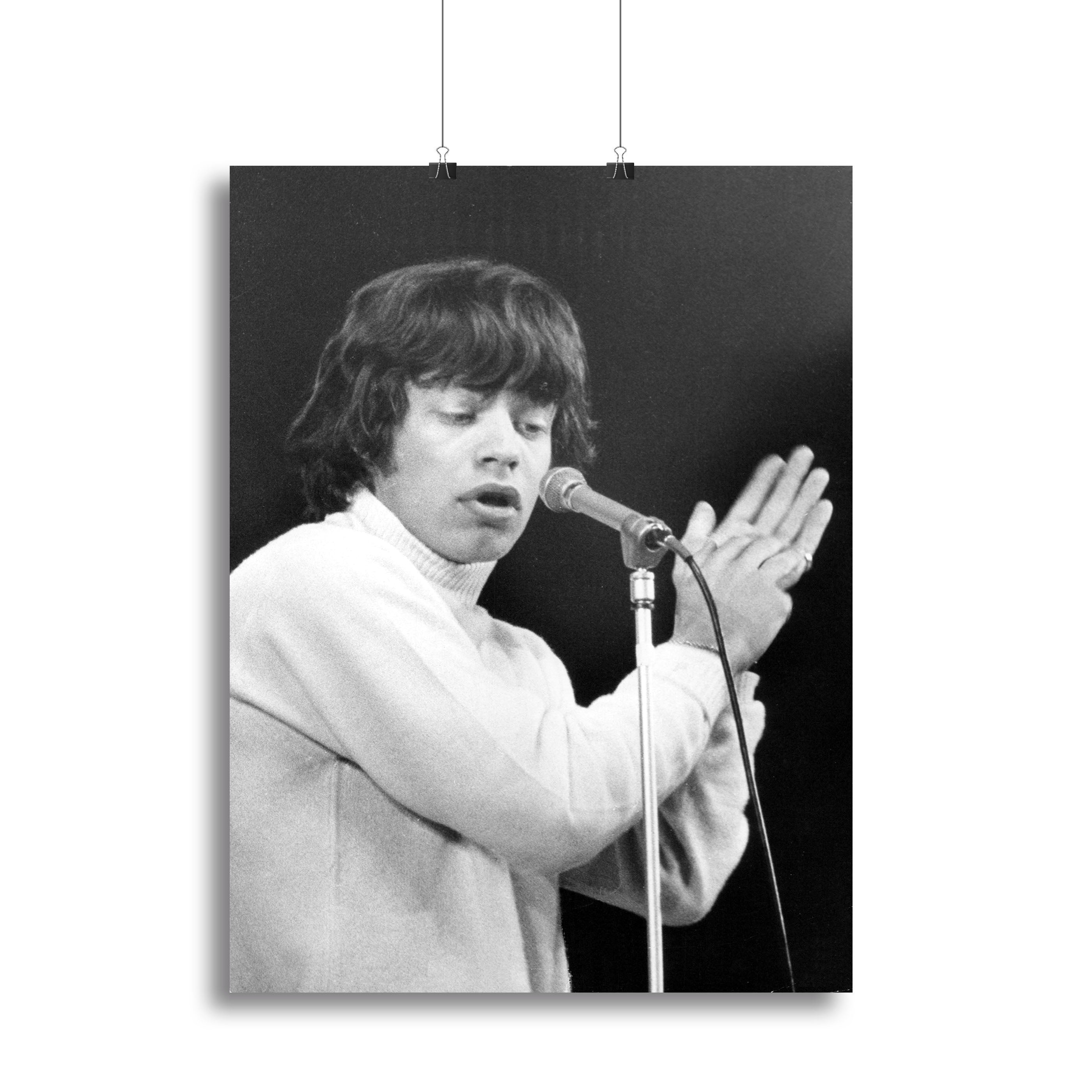 Mick Jagger performing on stage in 1965, captured in a vibrant canvas print or poster, showcasing the energy of rock music.