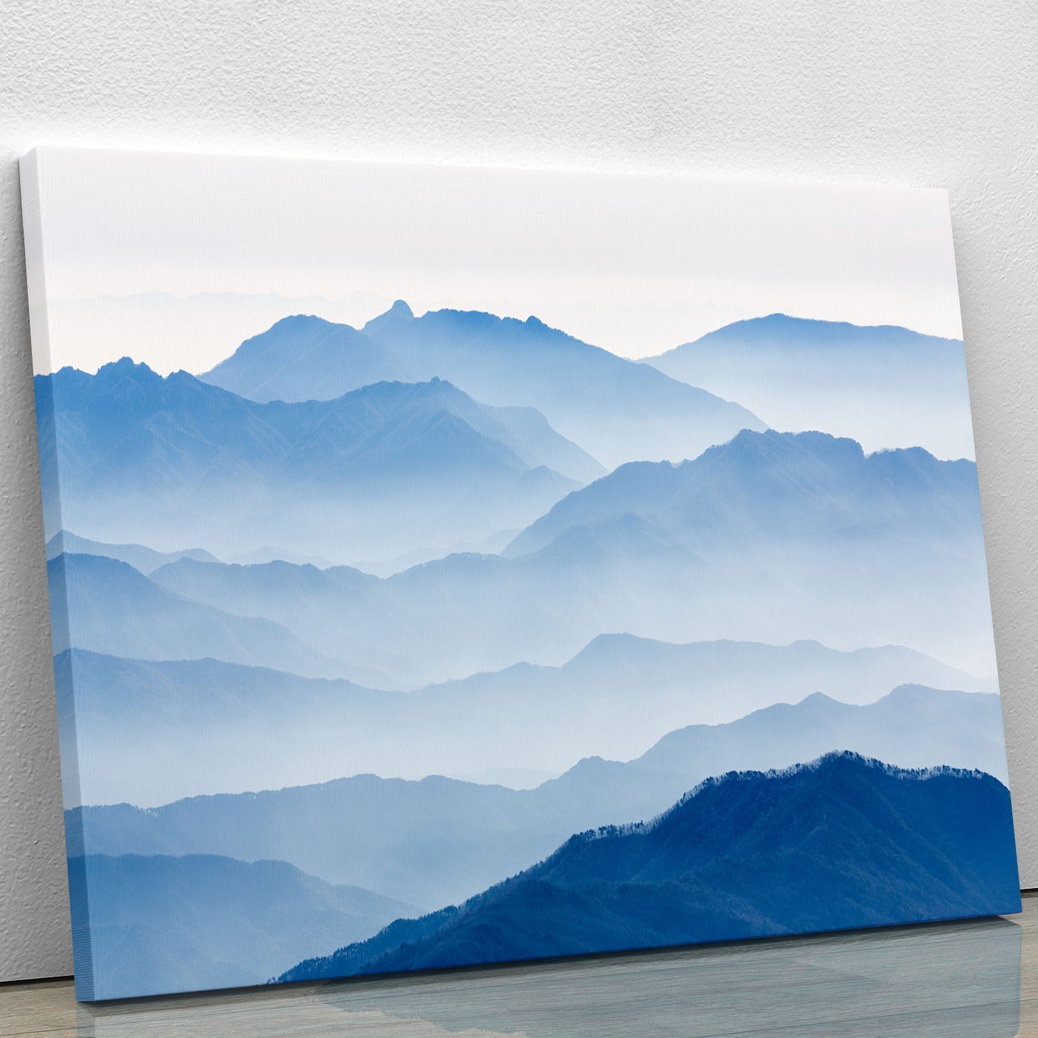A beautiful canvas print of misty mountains, showcasing serene natural beauty with soft colors and ethereal fog.