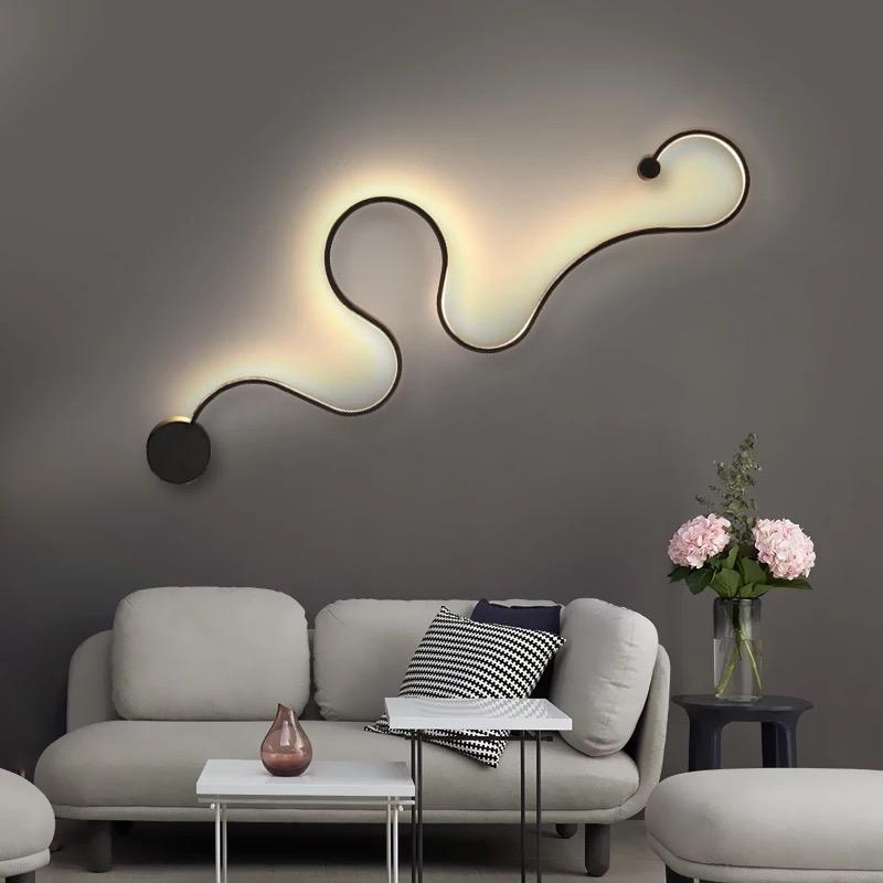 Modern Creative Art Serpentine Wall Lamp in white and black, showcasing its sleek design and touch switch feature.