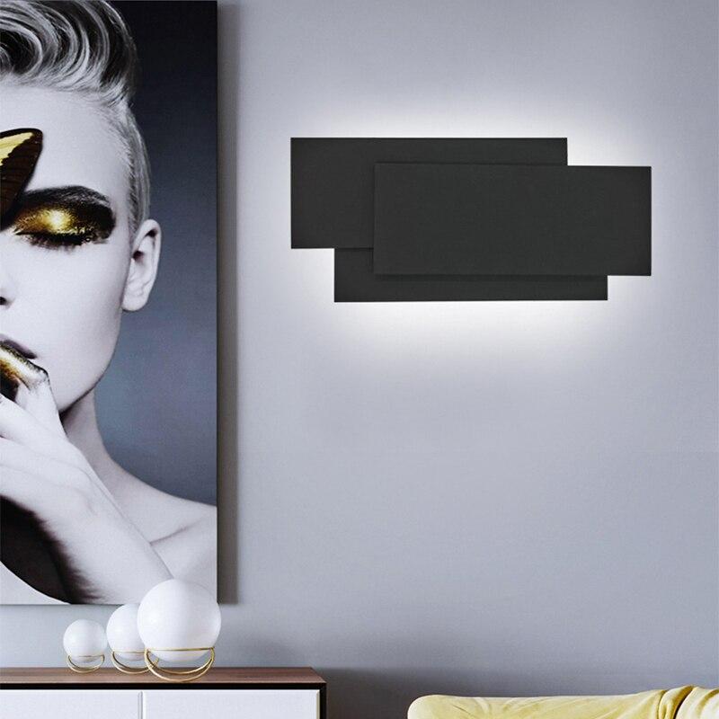 Modern Creativity LED wall lamp in black and white, showcasing its sleek aluminum and acrylic design, perfect for indoor lighting.