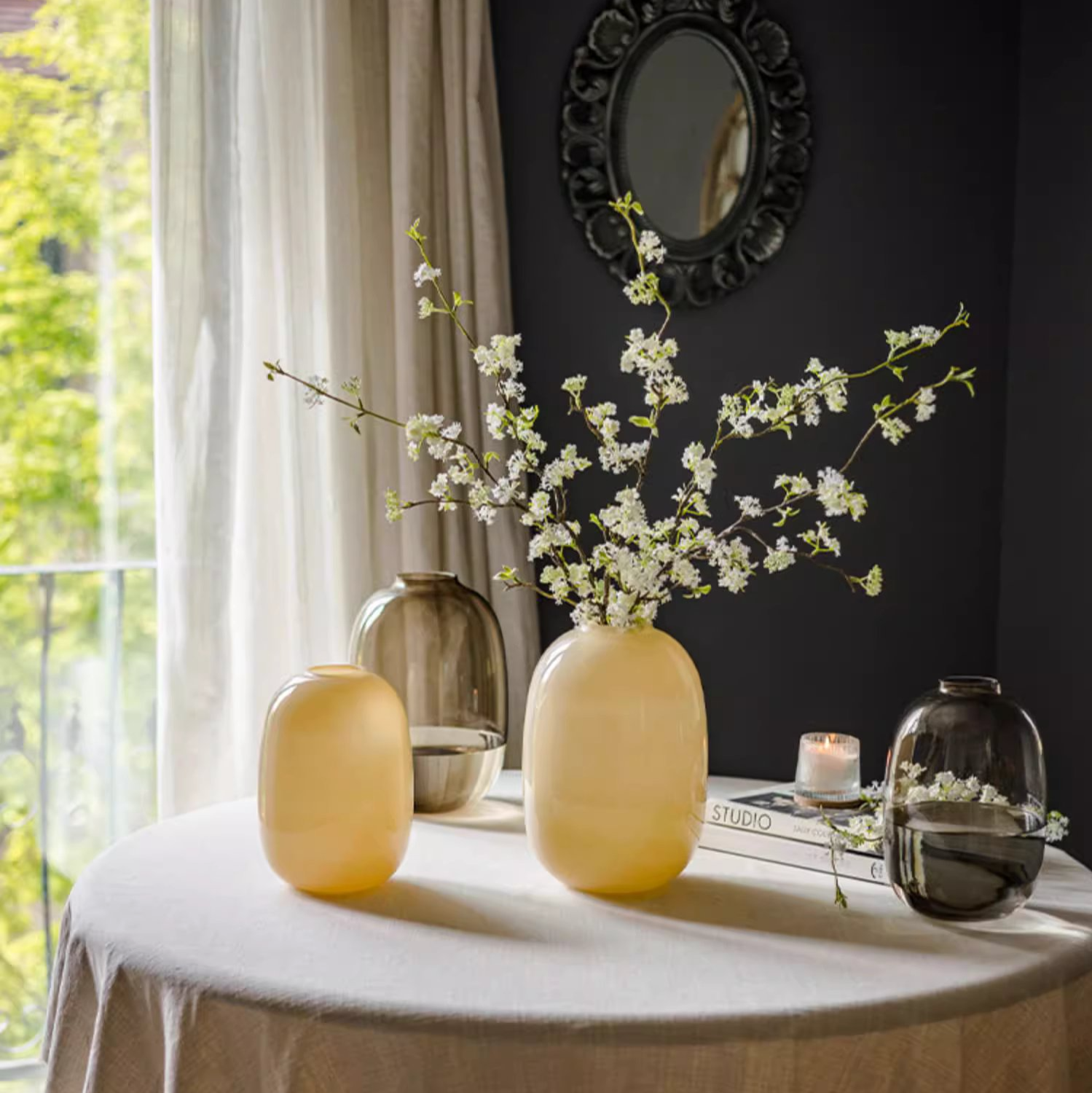 A modern hand-blown glass vase in vibrant yellow, showcasing its elegant design and perfect for floral arrangements.