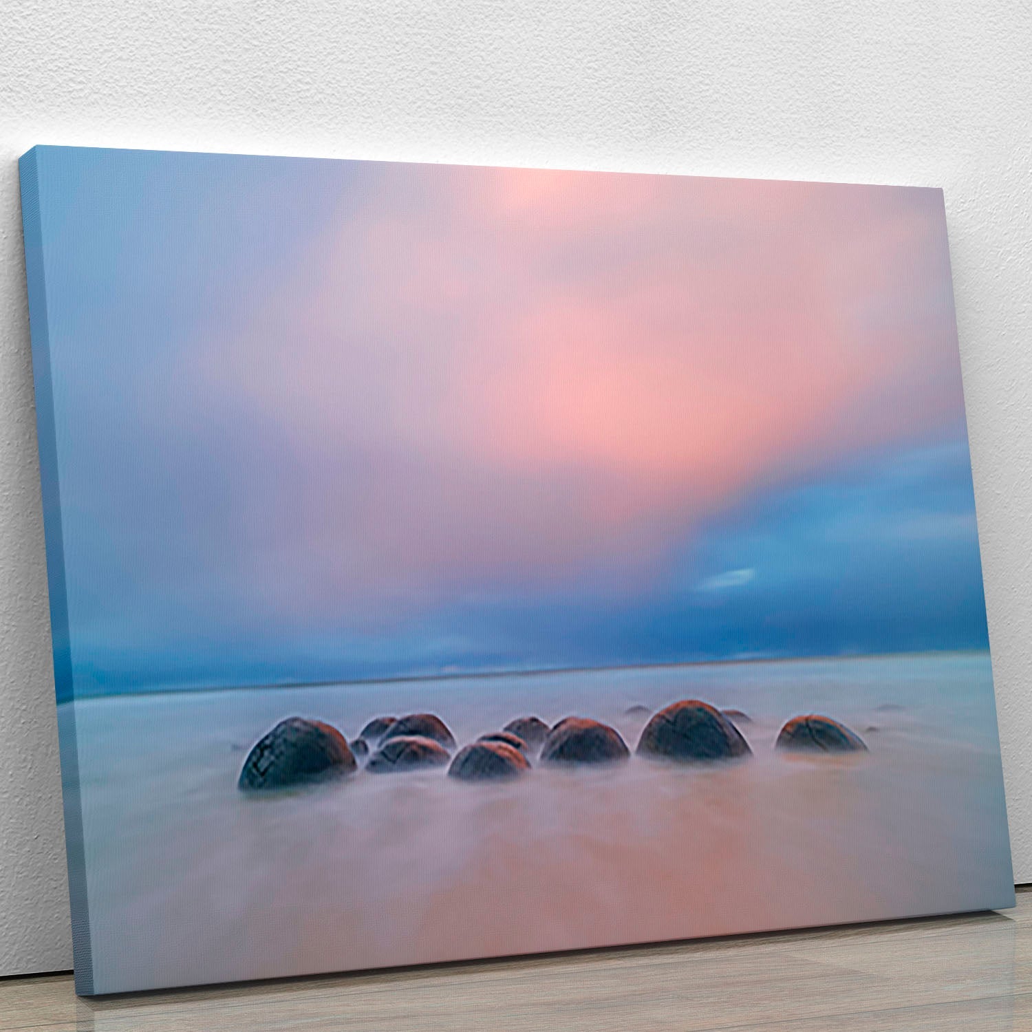 A beautiful canvas print of the Moeraki Boulders, showcasing their unique shapes and textures against a serene coastal backdrop.