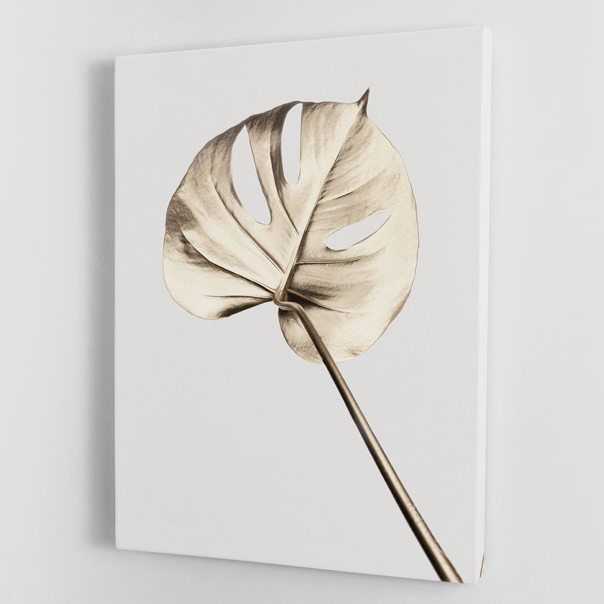 Monstera Gold 05 Canvas Print featuring vibrant green monstera leaves on a gold background, perfect for modern decor.