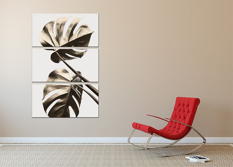 Monstera Gold 08 3 Split Panel Canvas Print featuring vibrant green monstera leaves on a gold background, elegantly displayed in three panels.
