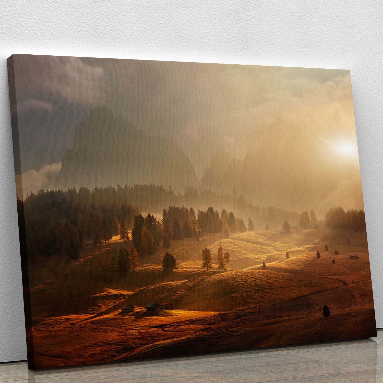 A beautiful canvas print of an alpine meadow at sunrise, featuring vibrant flowers and lush greenery under a clear blue sky.