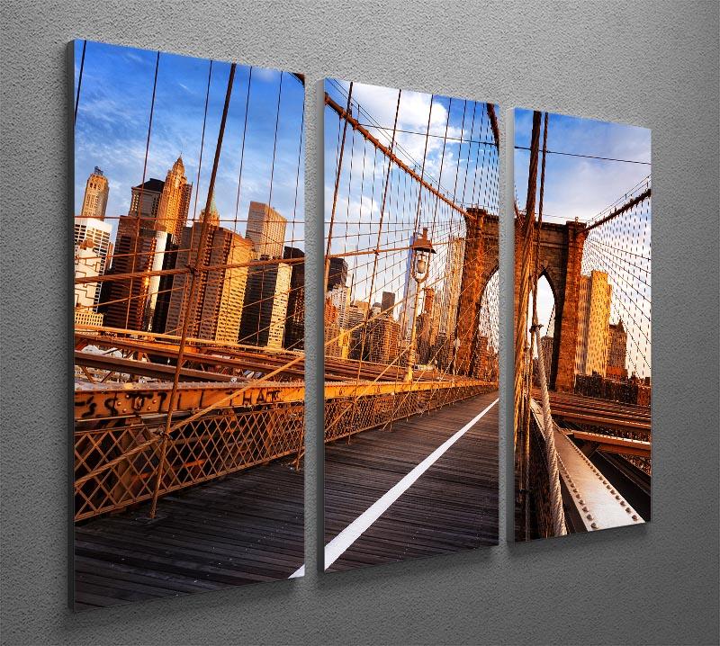 A stunning 3-panel canvas print depicting the Brooklyn Bridge at sunrise, showcasing vibrant colors and intricate details.