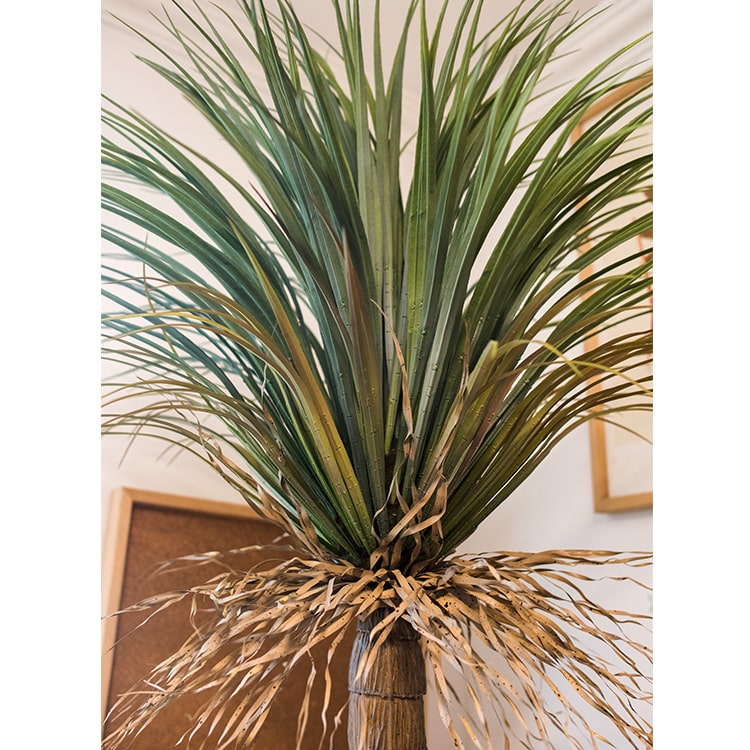 A lush Moroccan Artificial Palm Tree in a decorative pot, showcasing vibrant green leaves and realistic details, perfect for home decor.