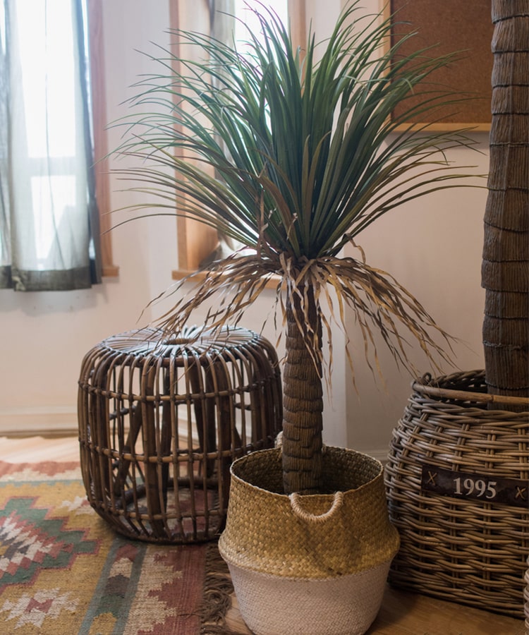 A lush Moroccan Artificial Palm Tree in a decorative pot, showcasing vibrant green leaves and realistic details, perfect for home decor.