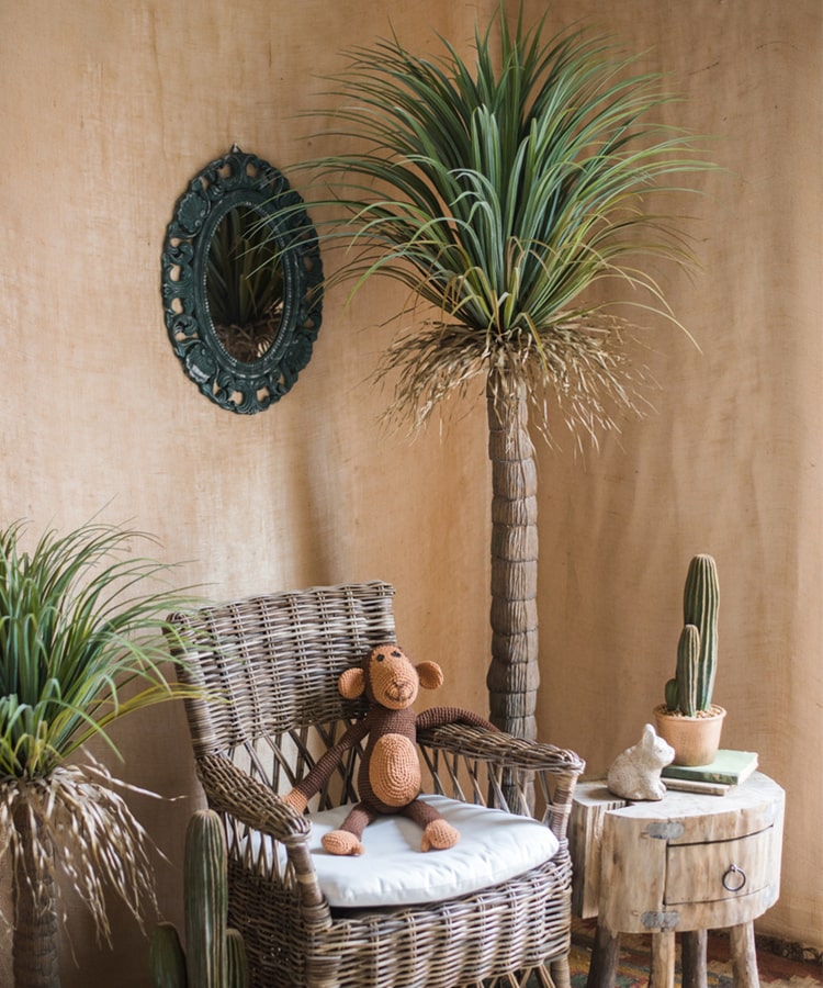 A lush Moroccan Artificial Palm Tree in a decorative pot, showcasing vibrant green leaves and realistic details, perfect for home decor.