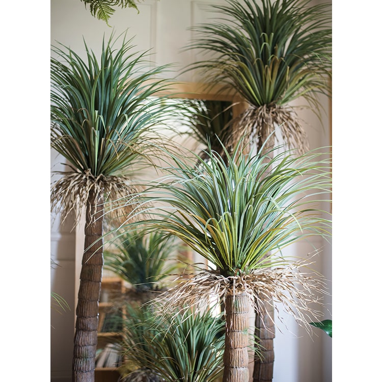 A lush Moroccan Artificial Palm Tree in a decorative pot, showcasing vibrant green leaves and realistic details, perfect for home decor.
