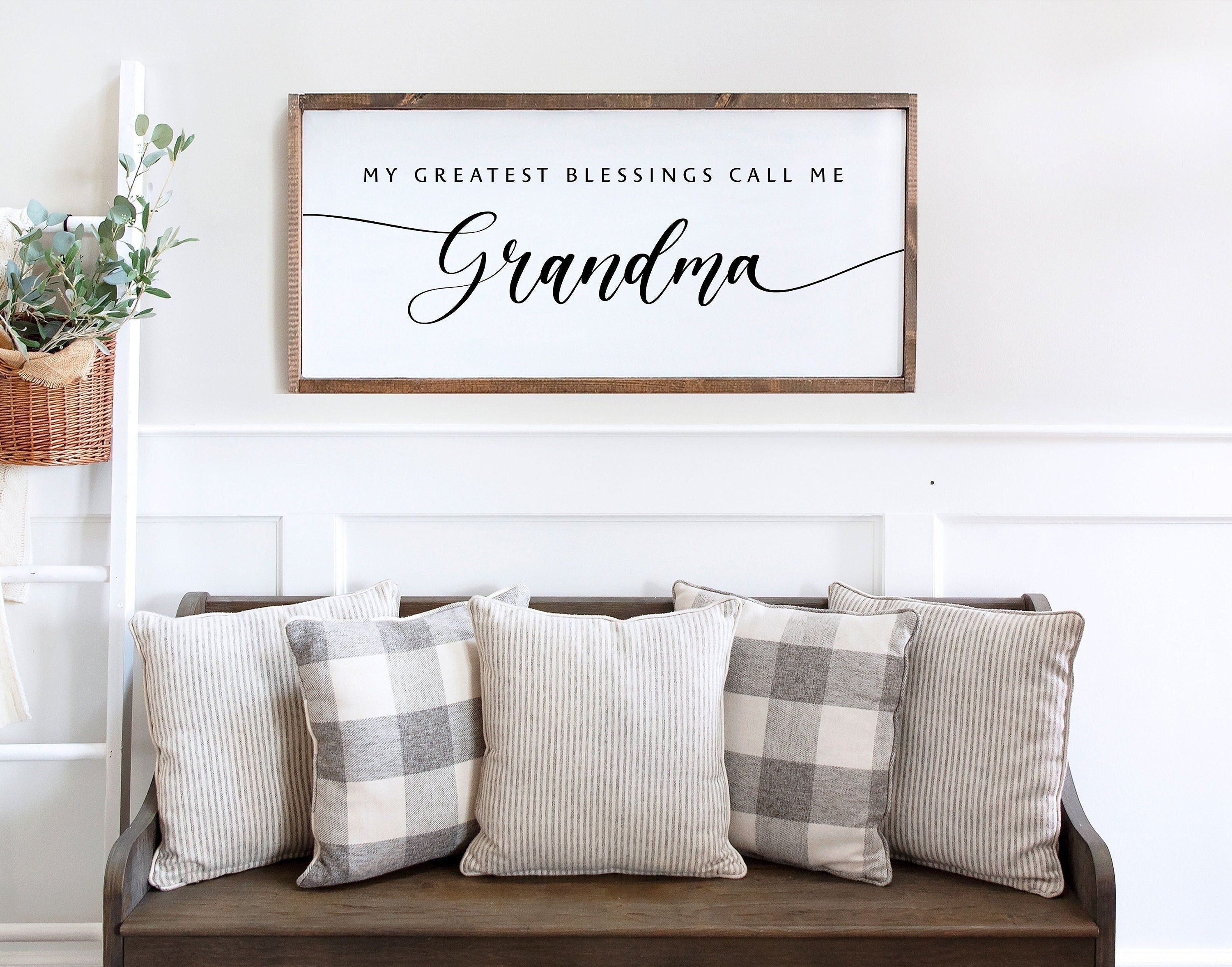 Rustic handmade wood sign with the phrase 'My Greatest Blessings Call Me Grandma' in hand-painted lettering on a dark walnut background.