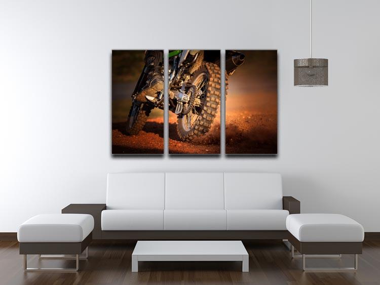 A stunning 3-panel canvas print featuring a motorbike racing on a dirt track, showcasing vibrant colors and dynamic motion.