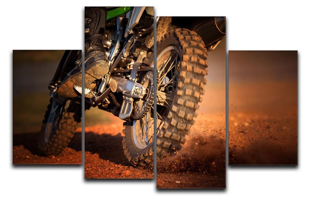 A stunning 4-split canvas artwork featuring a motorbike racing on a dirt track, showcasing dynamic movement and vibrant colors.