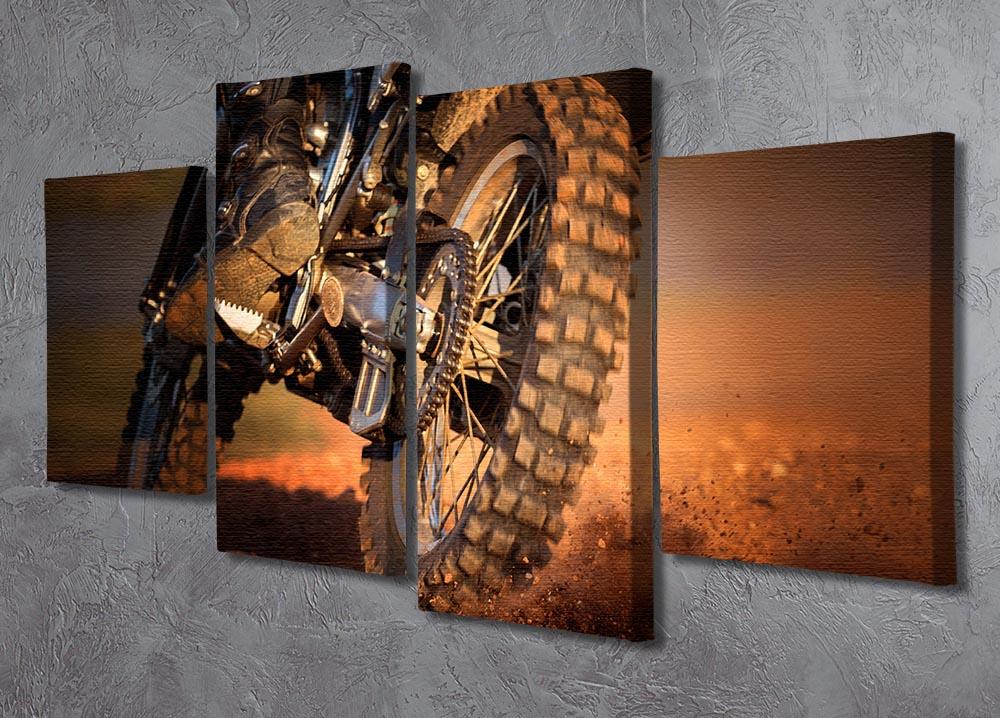 A stunning 4-split canvas artwork featuring a motorbike racing on a dirt track, showcasing dynamic movement and vibrant colors.