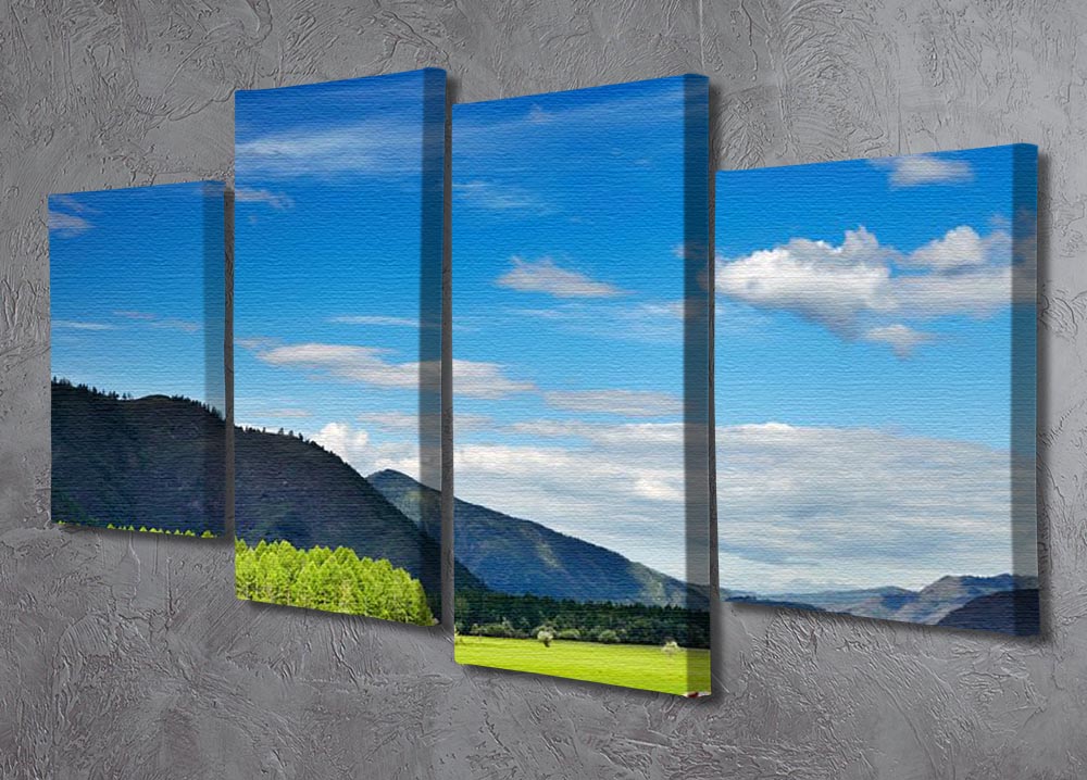 A beautiful 4-split canvas artwork depicting a mountain landscape with grazing cows under a vibrant sky, showcasing nature's tranquility.