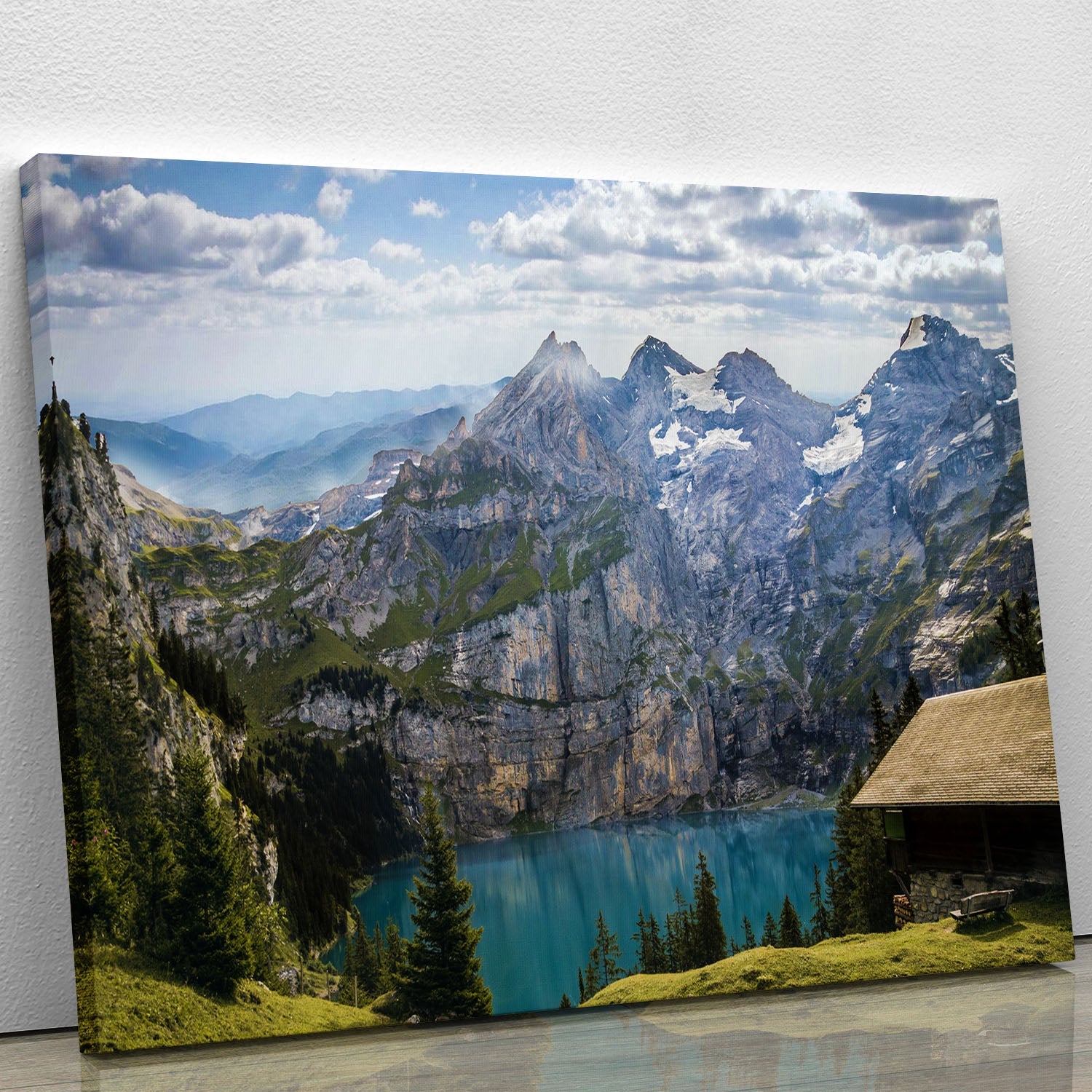 A beautiful canvas print featuring majestic mountains overlooking a serene lake, showcasing vibrant colors and intricate details.