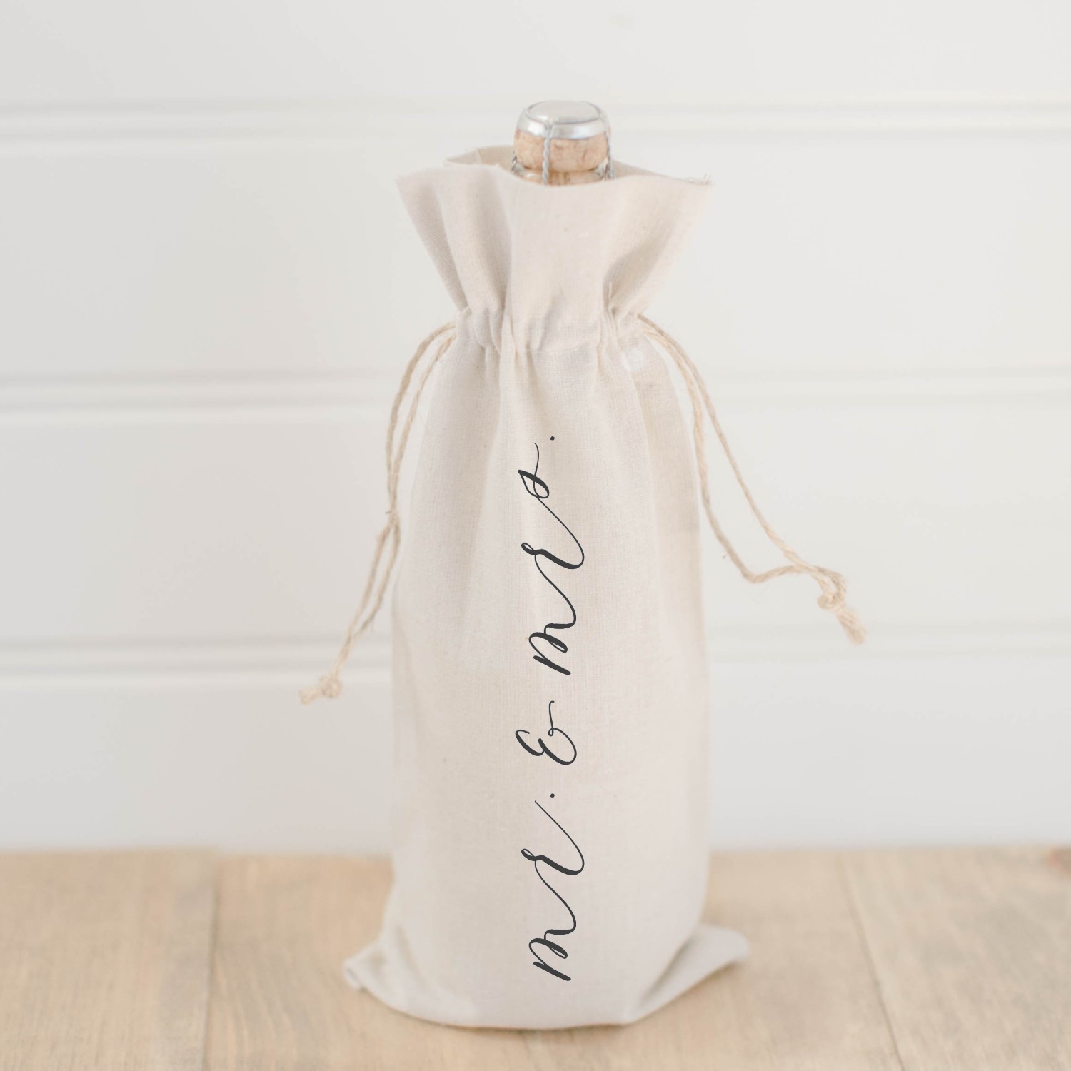 Stylish Mr. & Mrs. Calligraphy Wine Bag made from organic linen with twine drawstrings, featuring elegant calligraphy design.