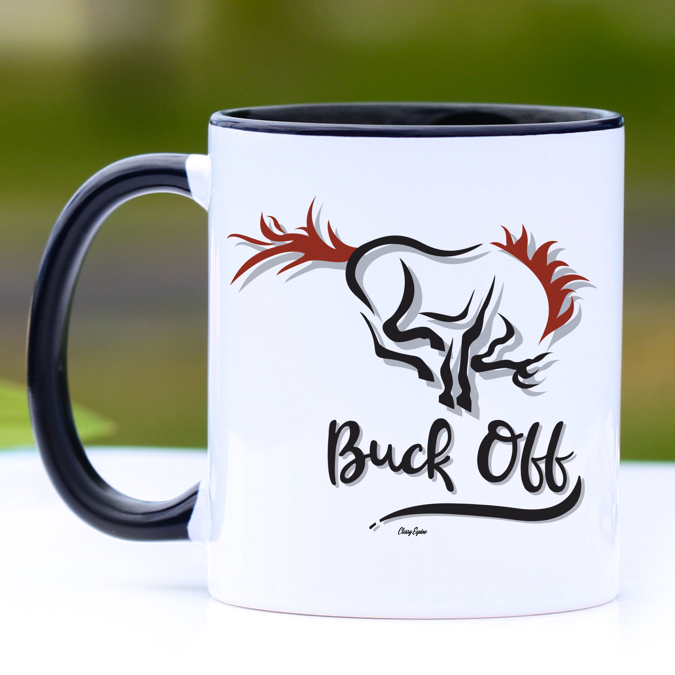 A stylish black mug with the phrase 'Buck Off' printed on it, featuring a black handle and interior, perfect for coffee or tea.