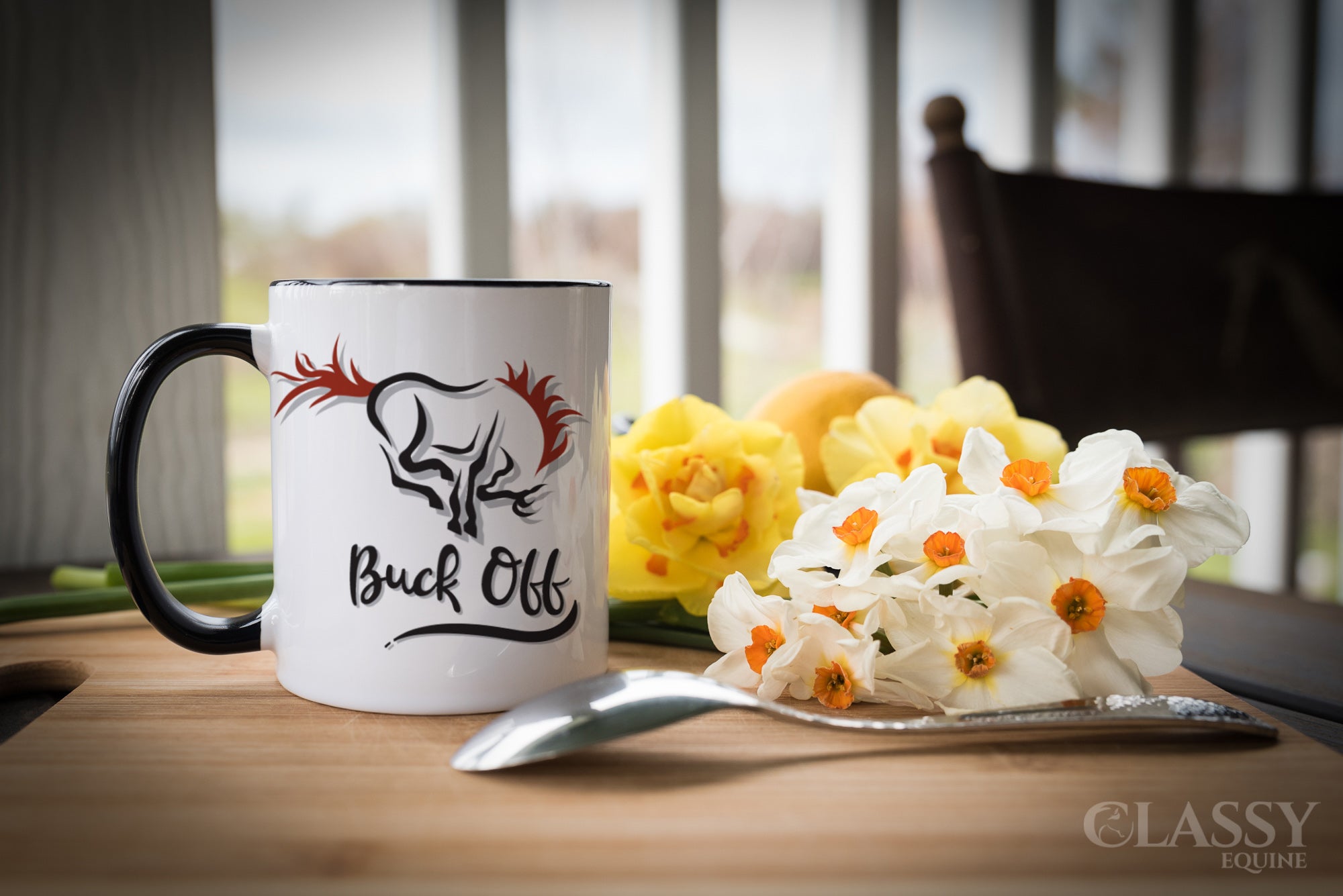 A stylish black mug with the phrase 'Buck Off' printed on it, featuring a black handle and interior, perfect for coffee or tea.