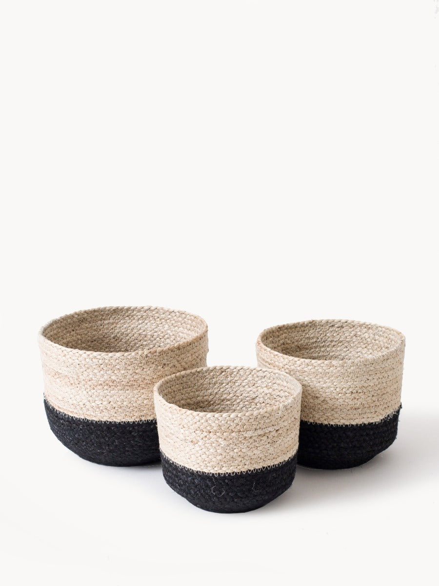 Handwoven Naiya Bin made from jute, featuring a natural and black design, available in three sizes.