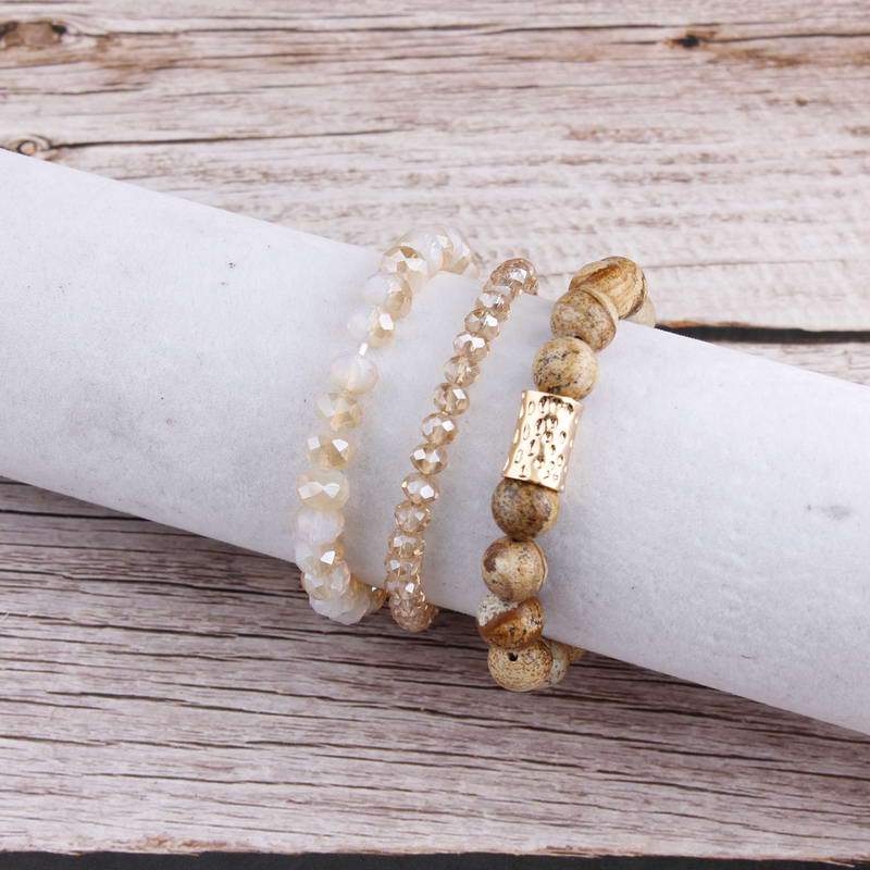 Natural Stone Mala Beads stacked stretch bracelet in various colors, showcasing natural stones and charm design.