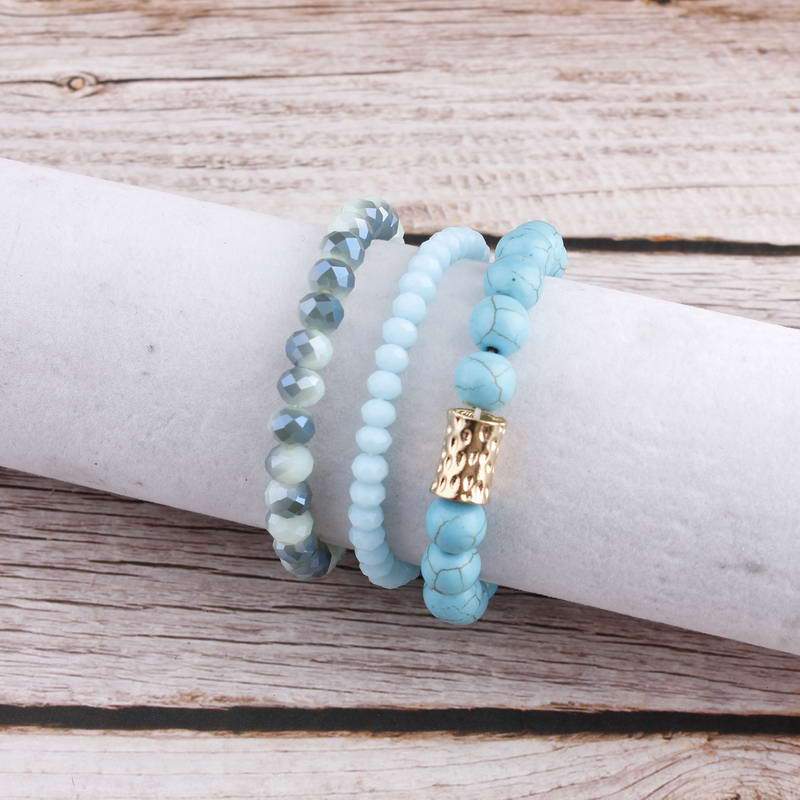 Natural Stone Mala Beads stacked stretch bracelet in various colors, showcasing natural stones and charm design.