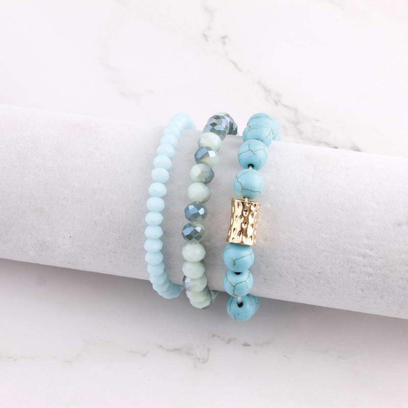 Natural Stone Mala Beads stacked stretch bracelet in various colors, showcasing natural stones and charm design.