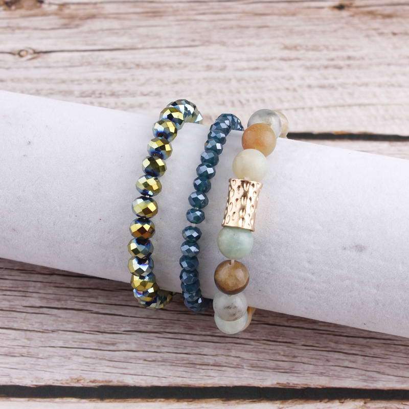 Natural Stone Mala Beads stacked stretch bracelet in various colors, showcasing natural stones and charm design.