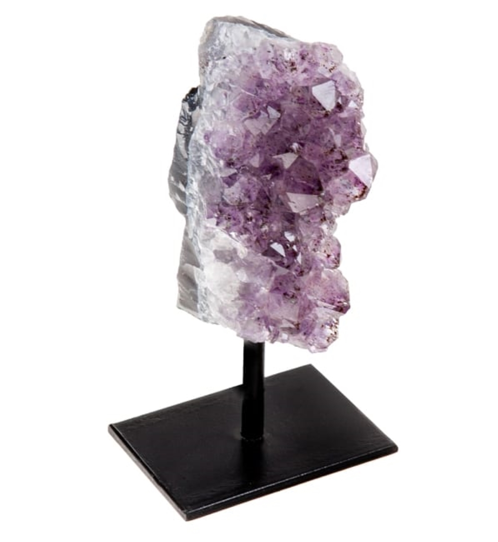 Natural stones display on a sleek metal base featuring Black Tourmaline, Pink Tourmaline, Blue Kyanite, and Amethyst Druzy, showcasing unique textures and colors.