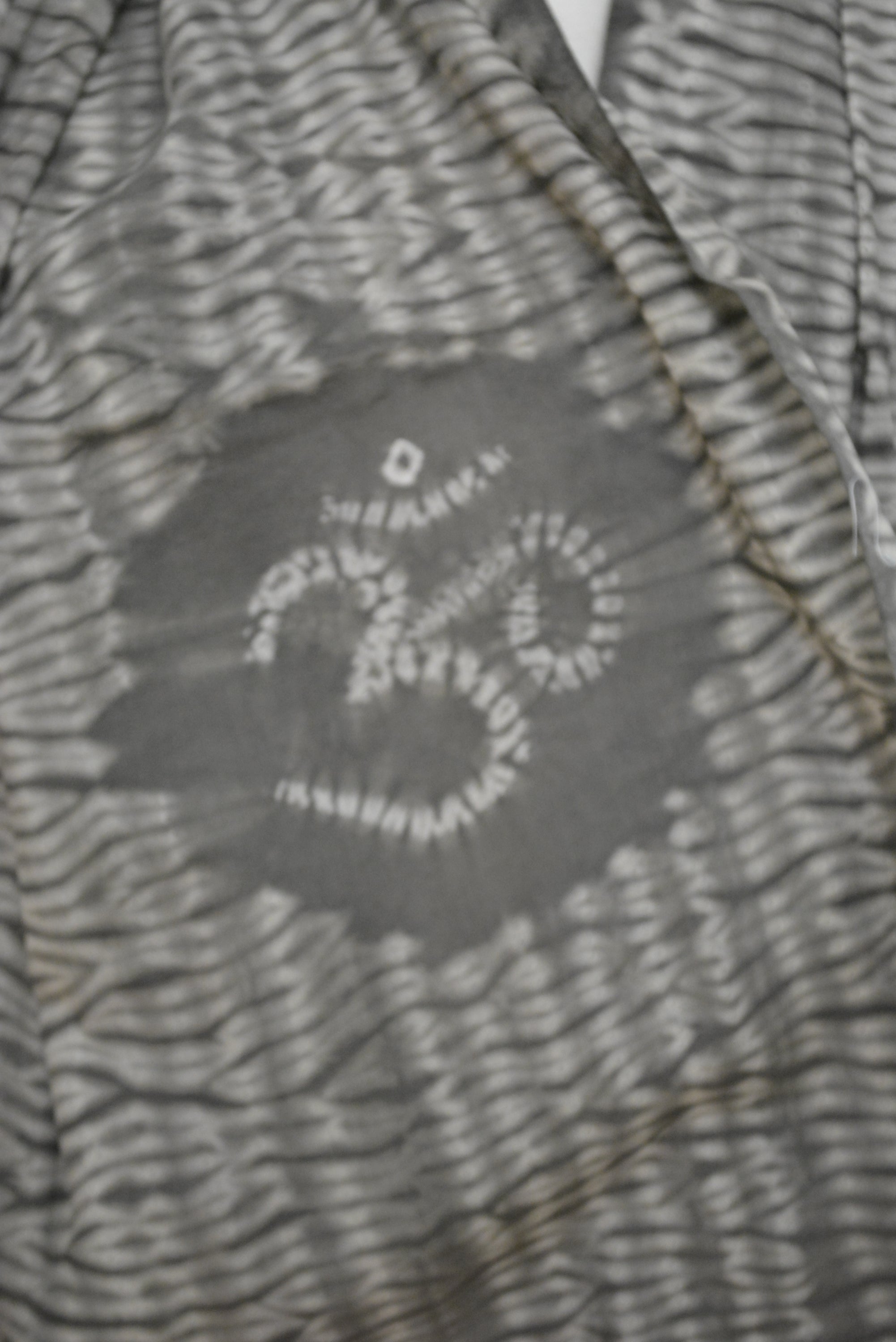 A beautifully hand-dyed cotton scarf showcasing vibrant colors and intricate patterns, crafted by Indian artisans.