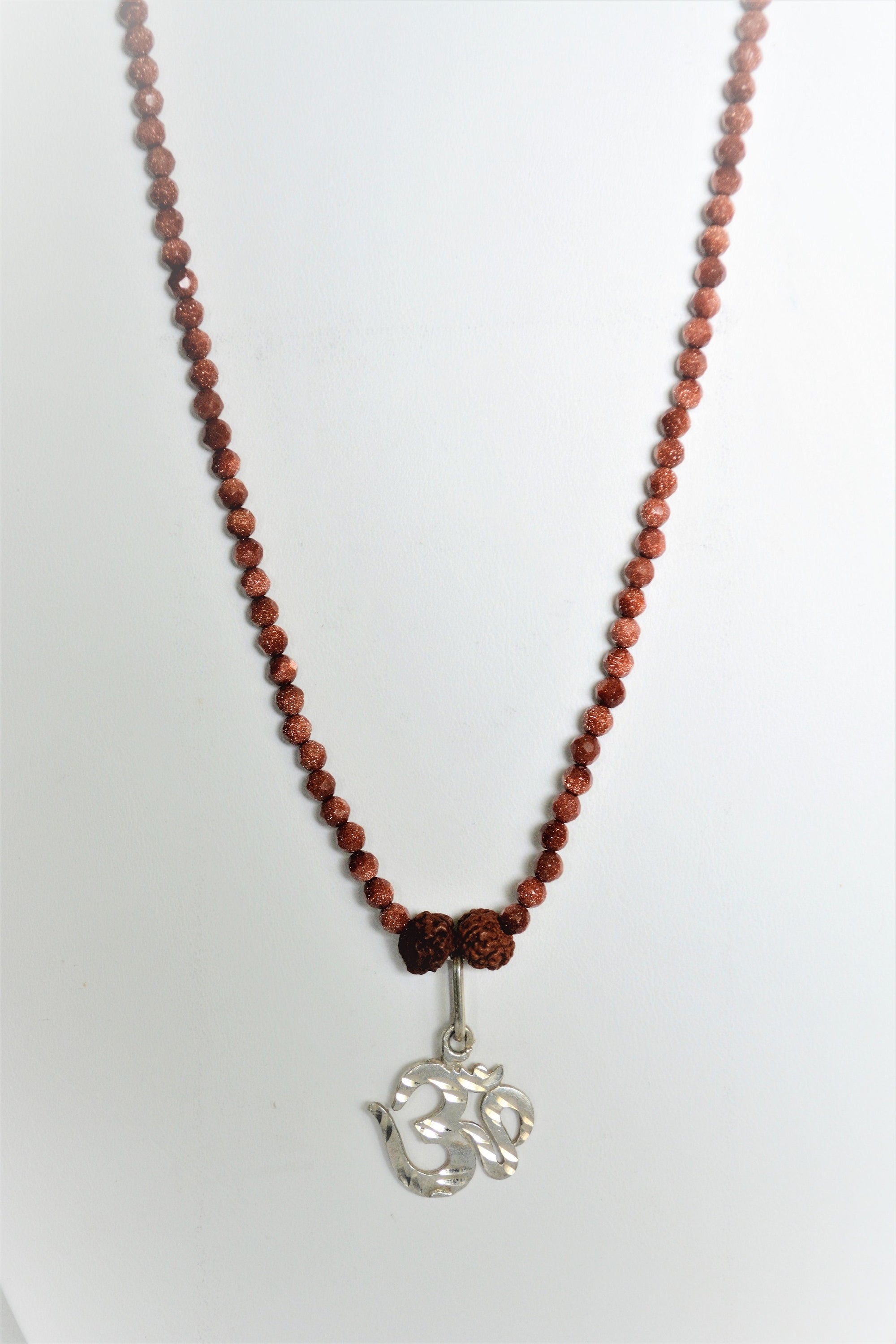 A beautiful necklace featuring a handcrafted silver pendant, showcasing intricate designs by women artisans.