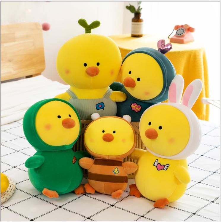A collection of Kawaii plush toys including a duck, dinosaur, and rabbit, showcasing their vibrant colors and soft textures, perfect for kids.