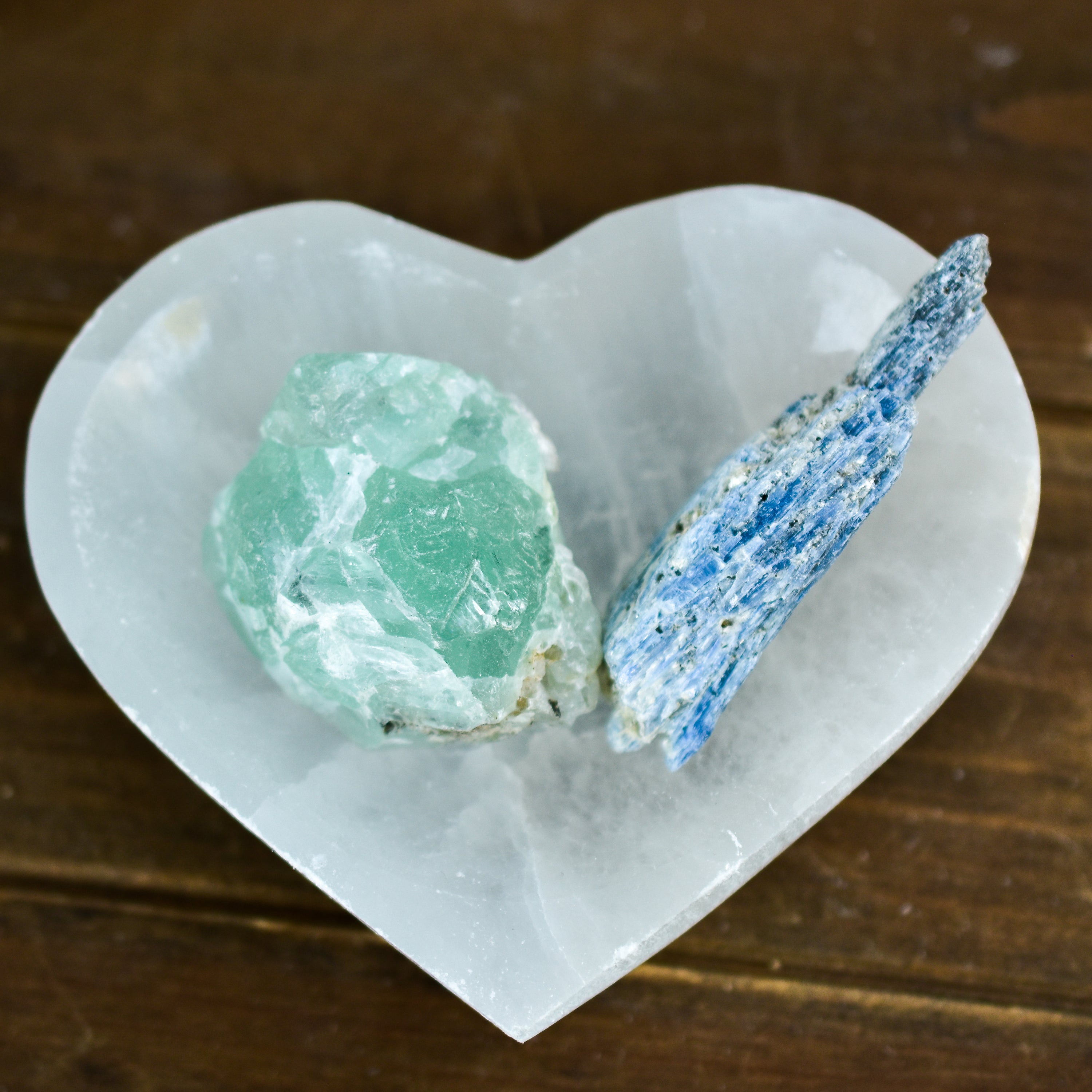 A beautifully crafted NEW Selenite Heart Bowl, handmade in Morocco, perfect for holding crystals and jewelry.