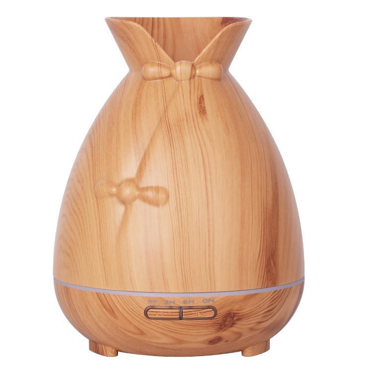New Wood Mini Ultrasonic Humidifier in dark brown color, showcasing its vase design and color-changing LED lights.