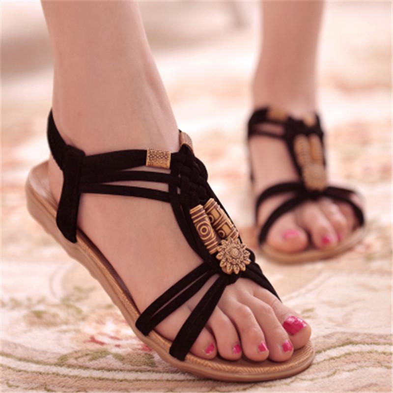 A pair of stylish Bohemia gladiator beach sandals for women, featuring a flat design and open side vamp, perfect for summer wear.