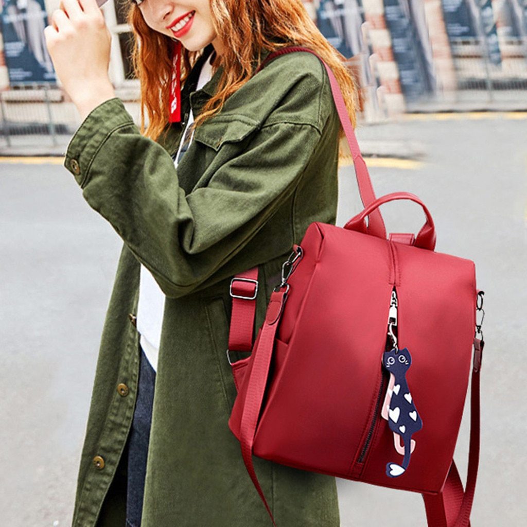 New Women's Anti-theft Backpack in solid color, made of durable Oxford cloth, featuring soft straps and spacious compartments for school and travel.