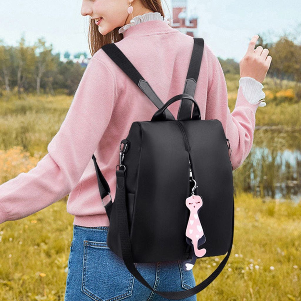 New Women's Anti-theft Backpack in solid color, made of durable Oxford cloth, featuring soft straps and spacious compartments for school and travel.