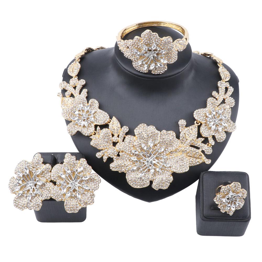 A beautiful multi-flower cluster statement jewelry set for brides, featuring sparkling rhinestones and available in gold and silver plating.