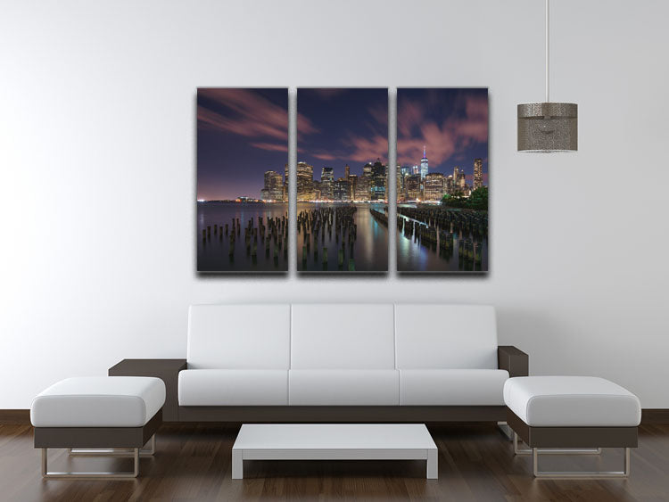 A stunning 3-panel canvas print depicting New York City at night, showcasing vibrant lights and iconic skyline.