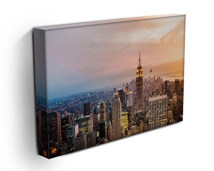 A beautiful canvas print of the New York City skyline at sunset, showcasing vibrant colors and iconic buildings.