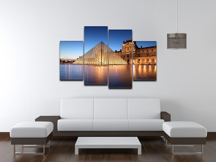 A stunning night scene of the Louvre Museum displayed on a 4 split panel canvas, showcasing intricate details and vibrant colors.