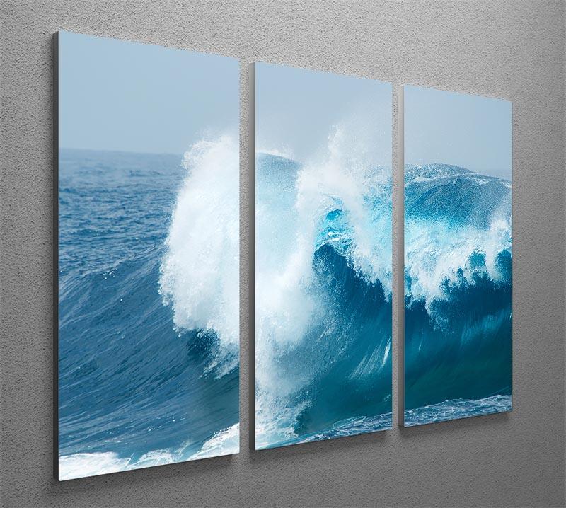 A beautiful 3-panel canvas print depicting ocean waves breaking against the shore, showcasing vibrant colors and intricate details.