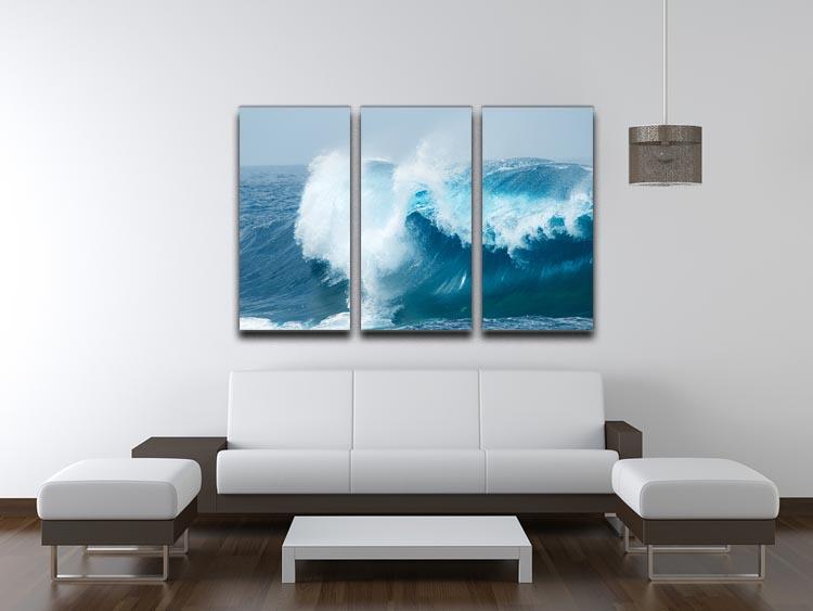A beautiful 3-panel canvas print depicting ocean waves breaking against the shore, showcasing vibrant colors and intricate details.