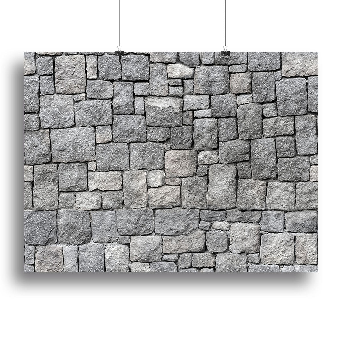 A beautiful canvas print featuring an old gray stone wall, showcasing intricate textures and rustic charm, perfect for home or office decor.