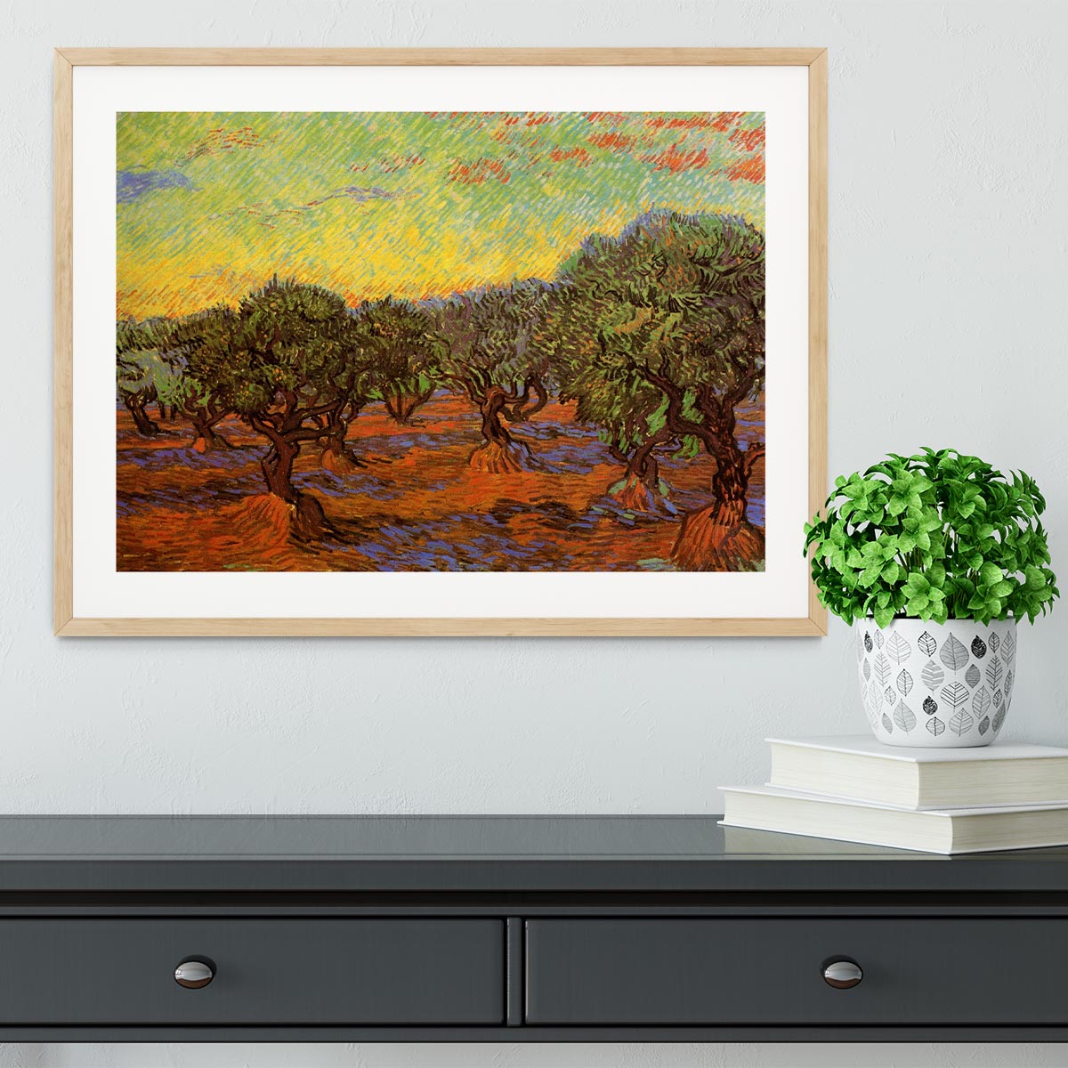 Framed print of Olive Grove Orange Sky by Van Gogh, showcasing vibrant colors and intricate details in a stylish frame.