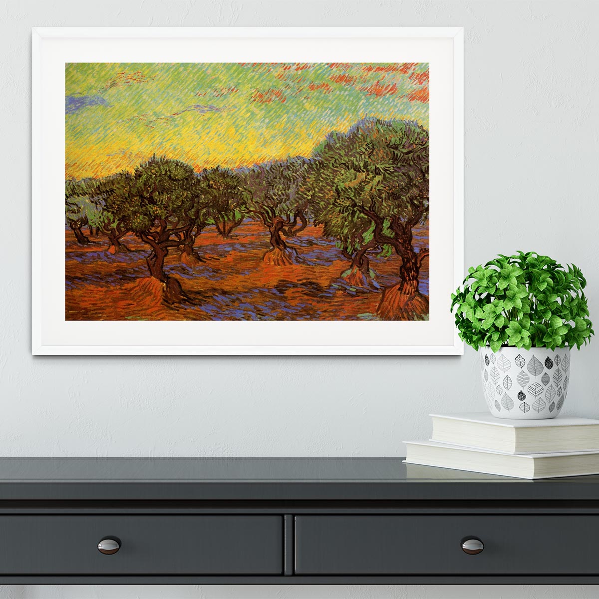 Framed print of Olive Grove Orange Sky by Van Gogh, showcasing vibrant colors and intricate details in a stylish frame.