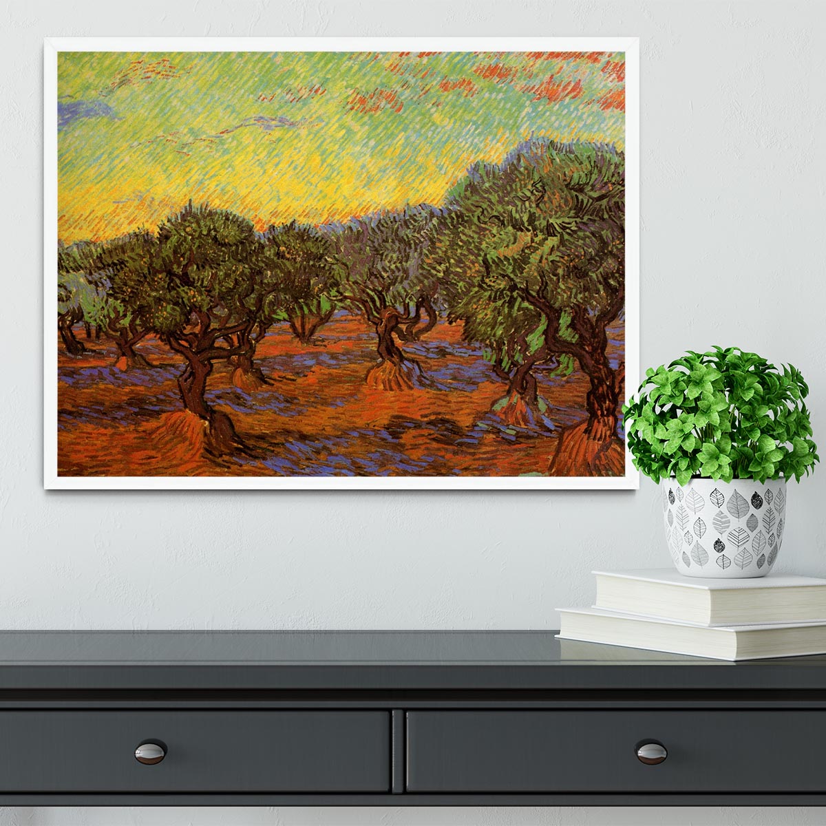 Framed print of Olive Grove Orange Sky by Van Gogh, showcasing vibrant colors and intricate details in a stylish frame.