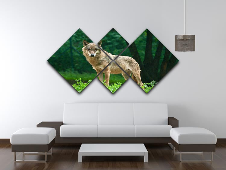 A majestic wolf standing on a vibrant green hill, depicted in a 4-square multi-panel canvas artwork.