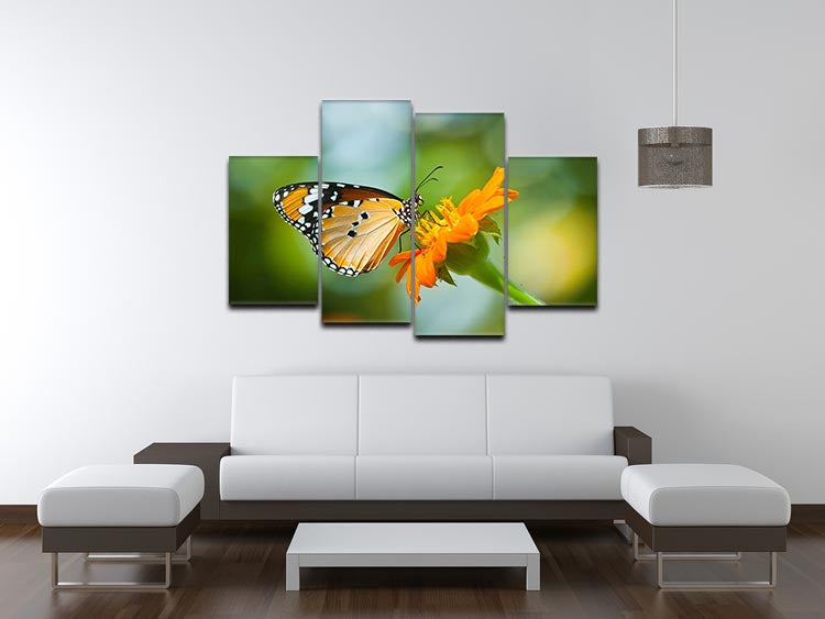 A vibrant orange butterfly resting on a colorful flower, displayed across four split canvas panels, creating a stunning visual effect.