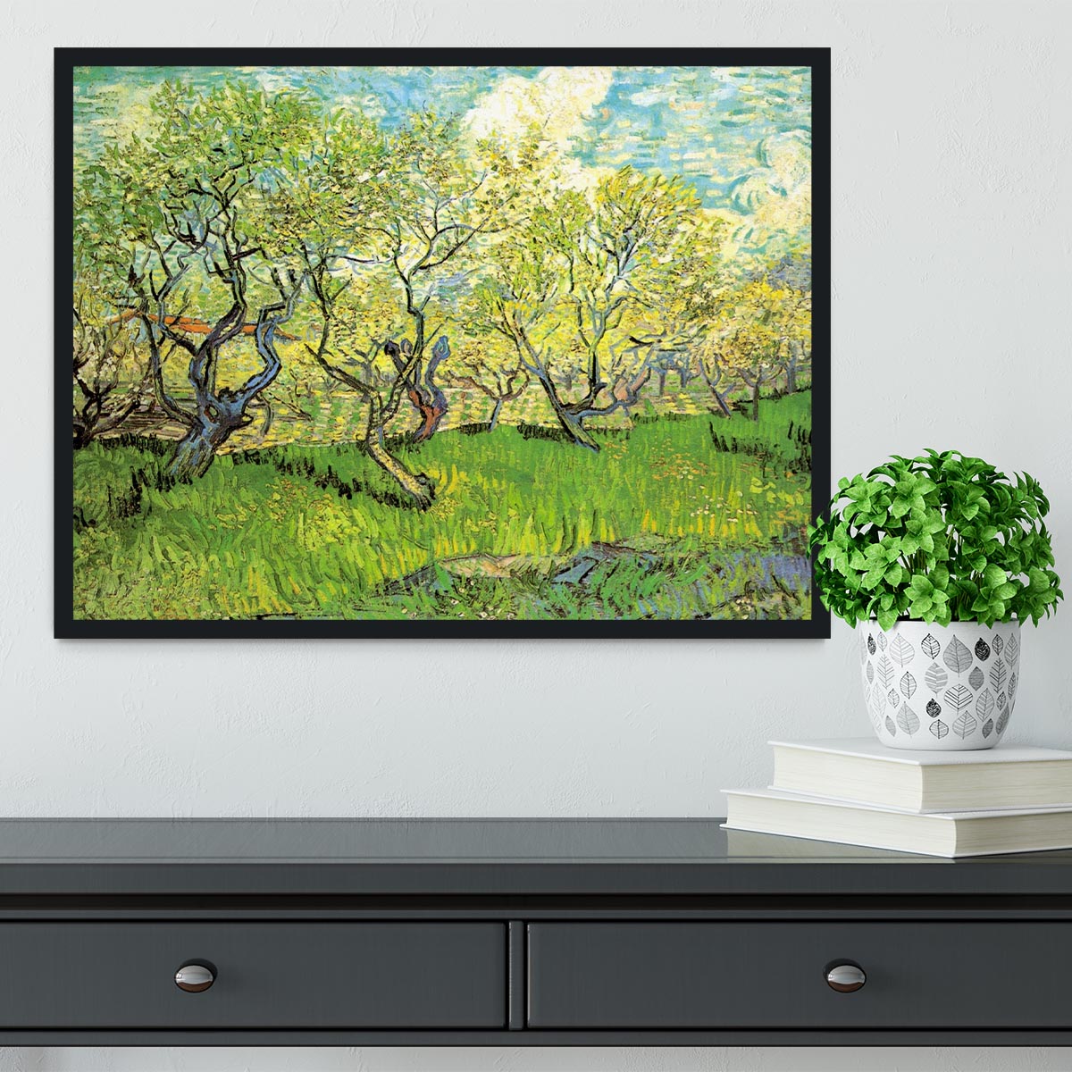 Framed print of Van Gogh's Orchard in Blossom 2, showcasing vibrant colors and intricate details in a stylish frame.